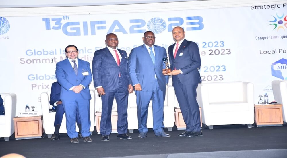 L-R: Mr. Humayon Dar, Director-General Cambridge Institute of Islamic Finance; Mr. Sherif Idi, Executive Director, TAJBank; His Excellency, Mr. Macky Sall, President of the Republic of Senegal; Mr. Hamid Joda, Managing Director/CEO TAJBank, during the presentation of the ‘Best Sukuk Deal of the Year 2023’ award to TAJBank Limited and ‘Most Promising CEO of the Year’ award to Hamid Joda at the just concluded Global Islamic Finance Award (GIFA) 2023 held in Dakar, Senegal.