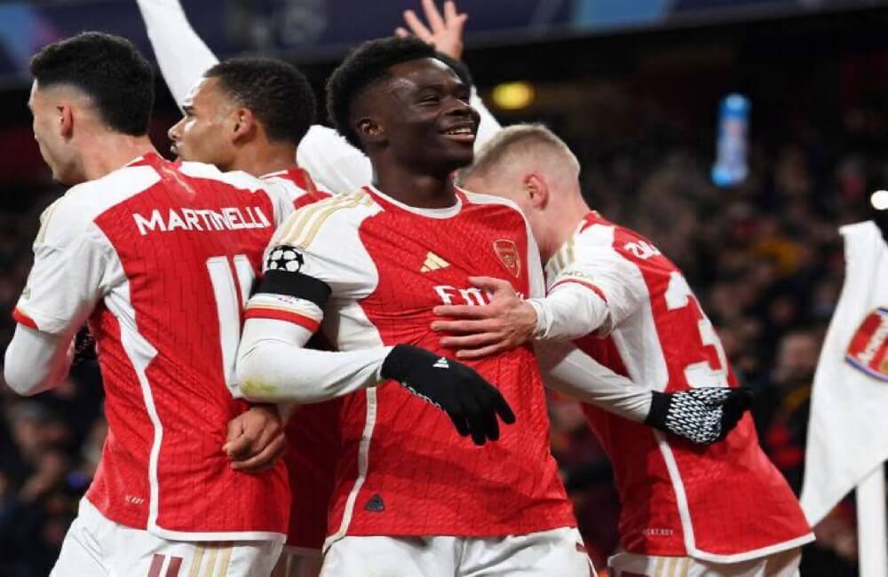 Arsenal Players Celebrate With Saka Against Lens
