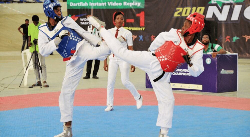 Two Taekwondo players battling it out