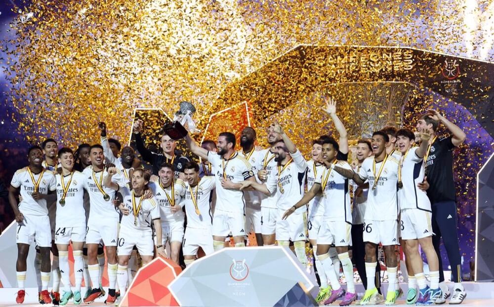 Real Madrid Players Celebrating With The Spanish Super Cup Trophy