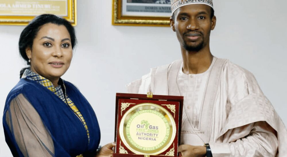 R-L The MD Oil & Gas Free Zones Authority Nigeria, Bamanga Usman Presenting a plaque to the Minister, FMITI, Dr Doris Anite