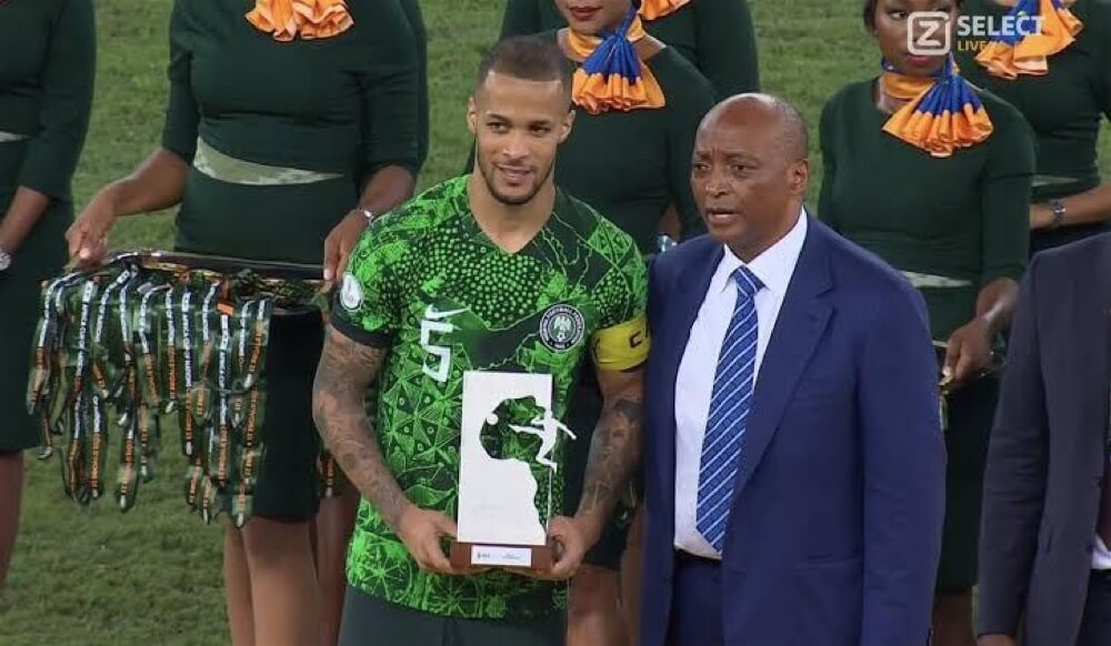 William Troost-Ekong Poses With The Player Of The Tournament Award with CAF President, Patrice Motzepe