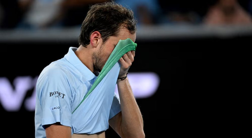 Russia's Daniil Medvedev wipes sweat off his face during his second round match against Learner Tien of the U.S.
