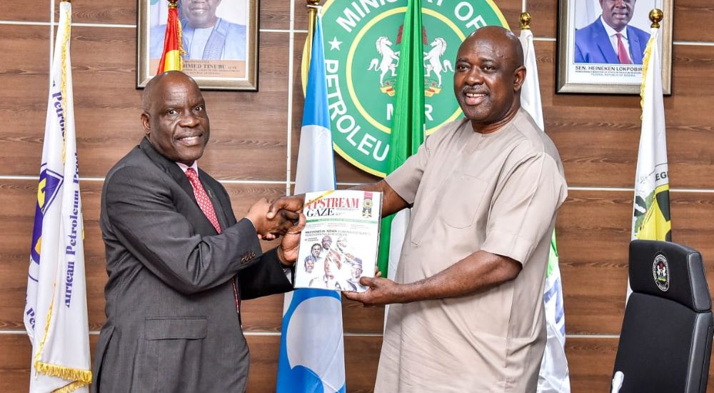 The Commission Chief Executive, Nigerian Upstream Petroleum Regulatory Commission, Engineer Gbenga Komolafe, presents a copy of the 4th edition of The Upstream Gaze to the Minister of State for Petroleum Resources (oil), Senator Heineken Lokpobiri, during a courtesy visit on the sidelines of the NUPRC’s 4th anniversary in Abuja.